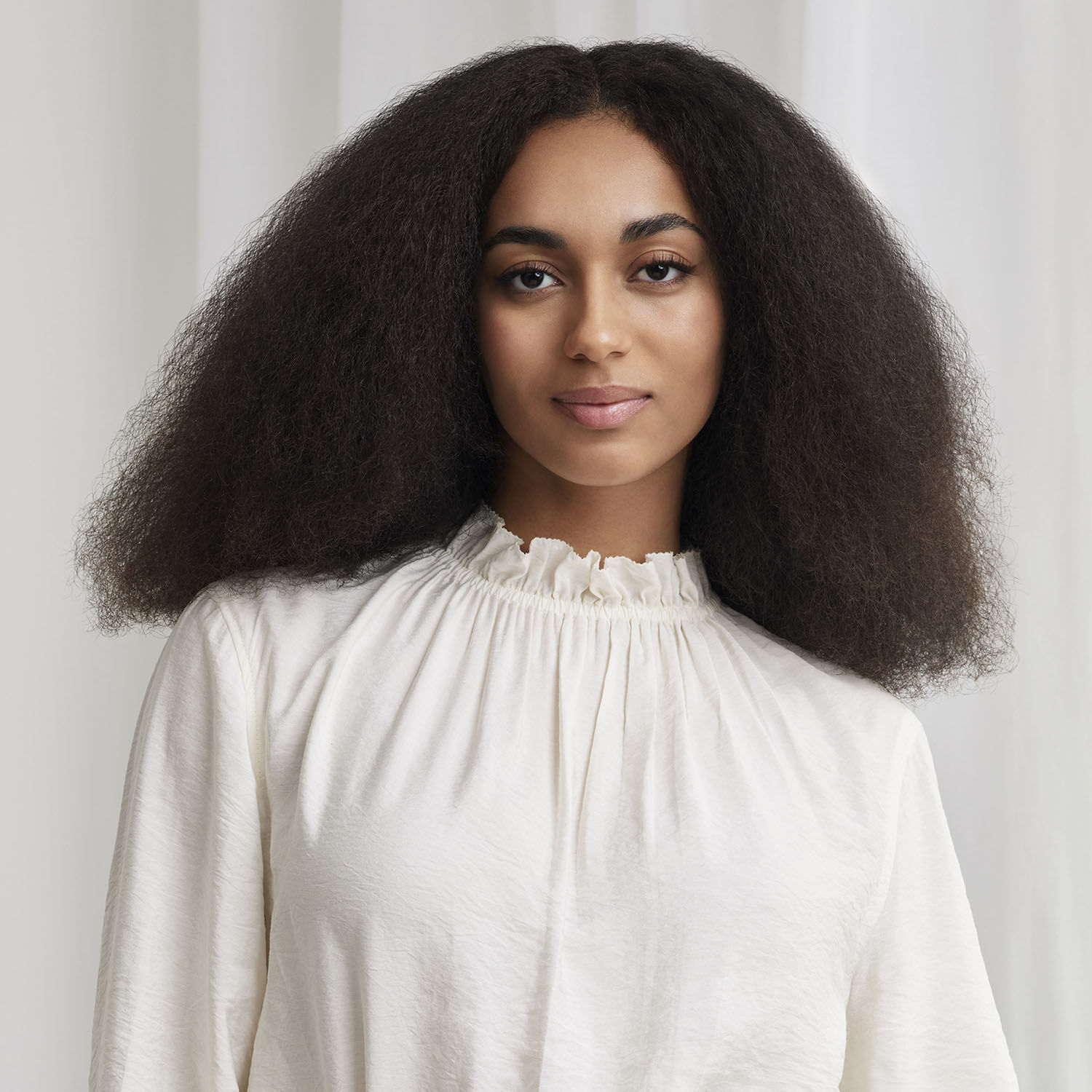 Model with hair styled using Air Wand Pik